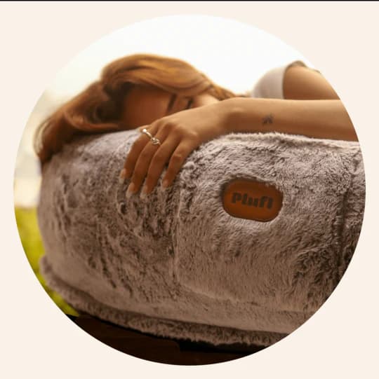 Person tucked into Plufl bed